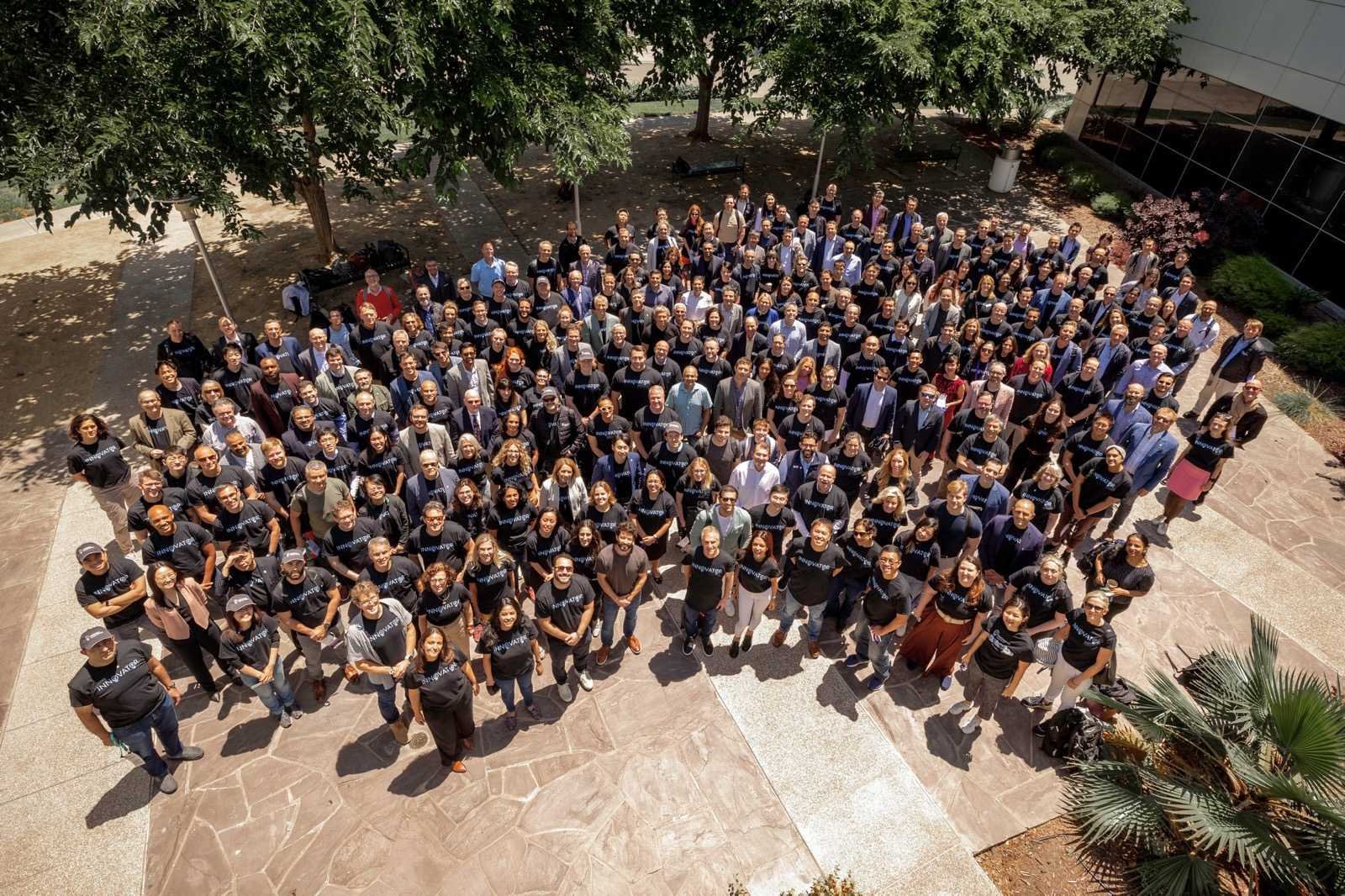Aerial group photo of Innovator Summit 2024 attendees in the courtyard of the Computer History Museum