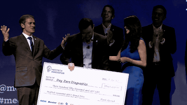 Day Zero Diagnostics team accepting the 2017 MedTech Innovator grand prize check on stage