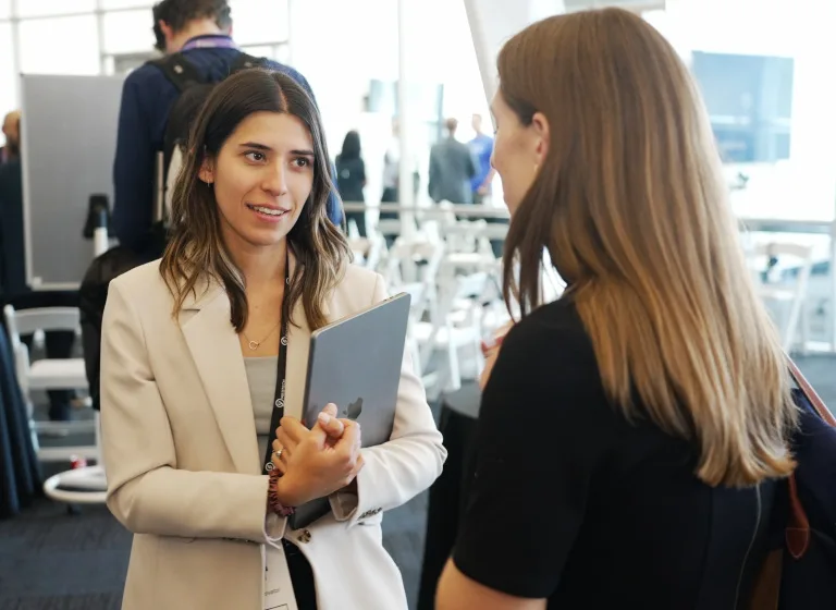 An MTI Fellow in conversation at an MTI event