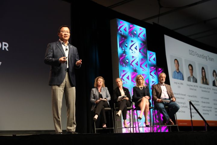 Day Zero Diagnostics CEO presenting to a judging panel on stage at the 2017 MedTech Innovator finals