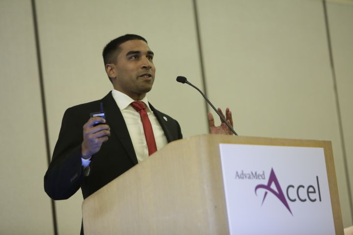 Presenter pitching at an AdvaMed Accel podium at the 2017 MedTech Innovator finals