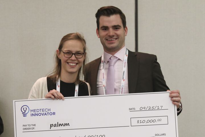 palmm team members holding a $10,000 MedTech Innovator check, September 2017