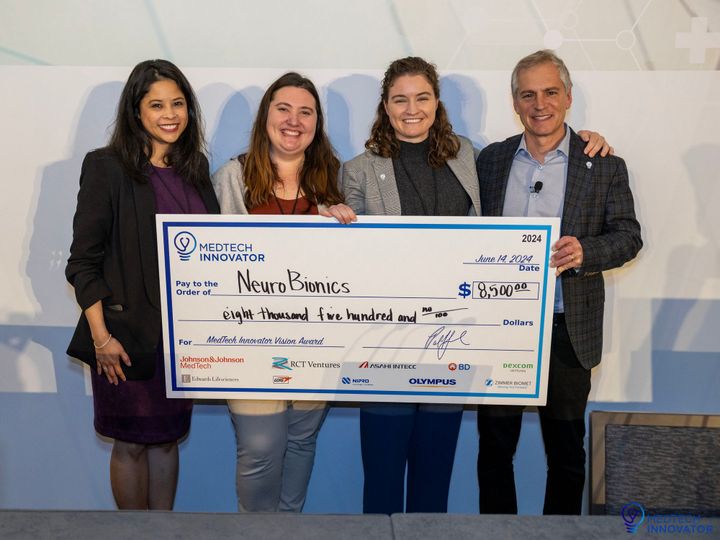 The NeuroBionics team receiving the $8,500 MedTech Innovator 2024 Vision Award check