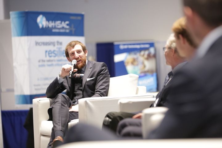 Panelist speaking into a microphone during a discussion at The MedTech Conference 2017