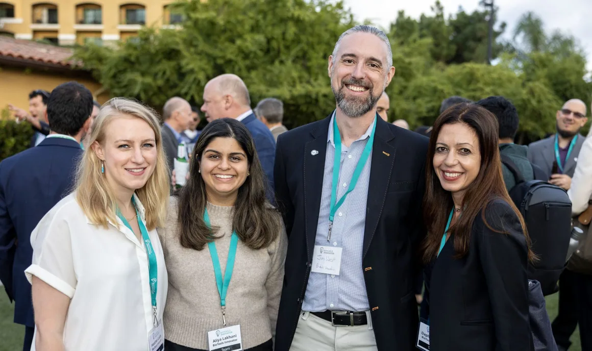MTI Fellows with team members at an outdoor reception