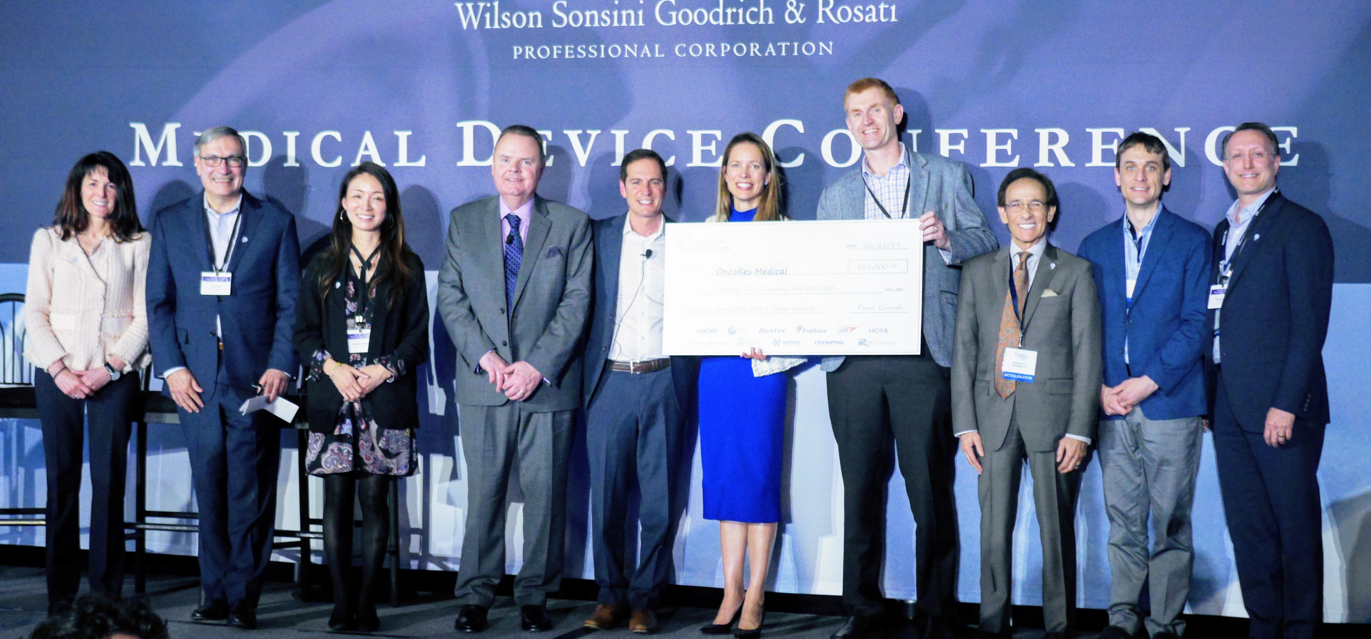OncoRes Medical team holding the 2019 MedTech Innovator Value Award check at the WSGR Medical Device Conference