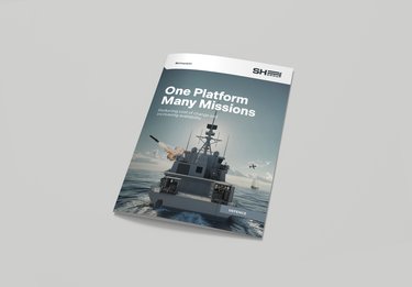A brochure cover featuring a naval ship at sea with the text "One Platform Many Missions." Helicopters and fighter jets are in the background.