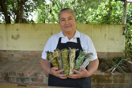 female farmer in equador holding product