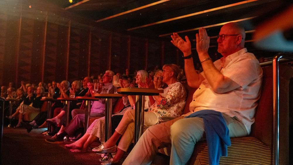 Guests enjoying entertainment in Ambition&rsquo;s Palladium theatre