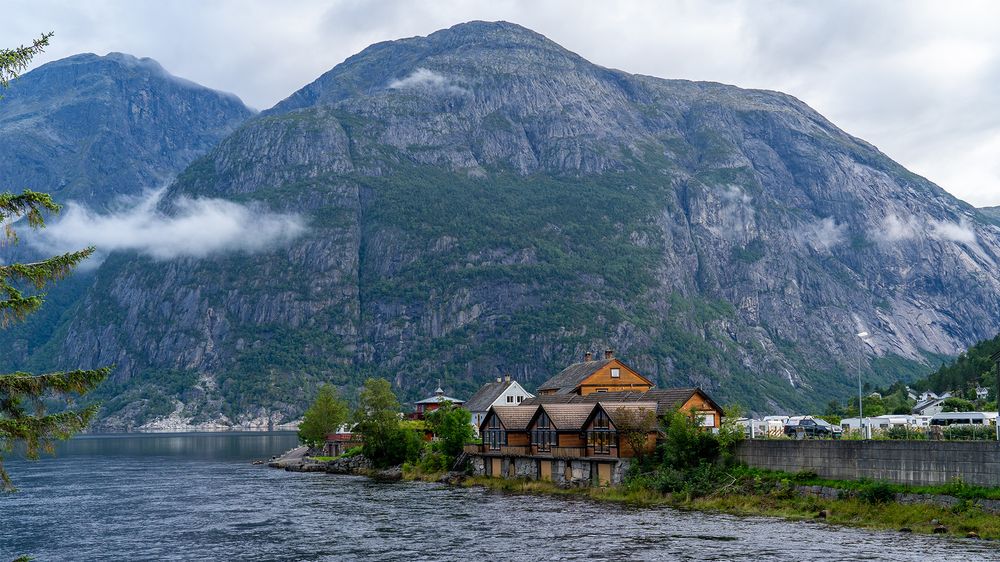 The village of Eidfjord beneath Norwegian mountains