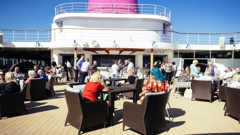 The outdoor pool and Pool Bar aboard Ambition