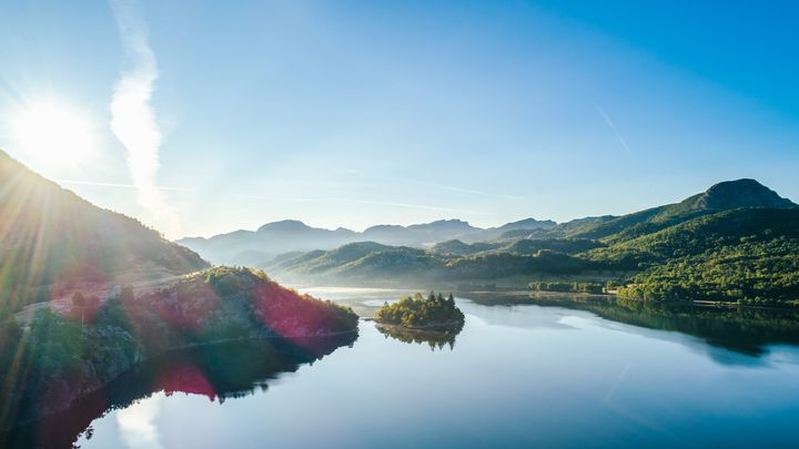 Sunlight over water and hills in the Sandnes region of Norway