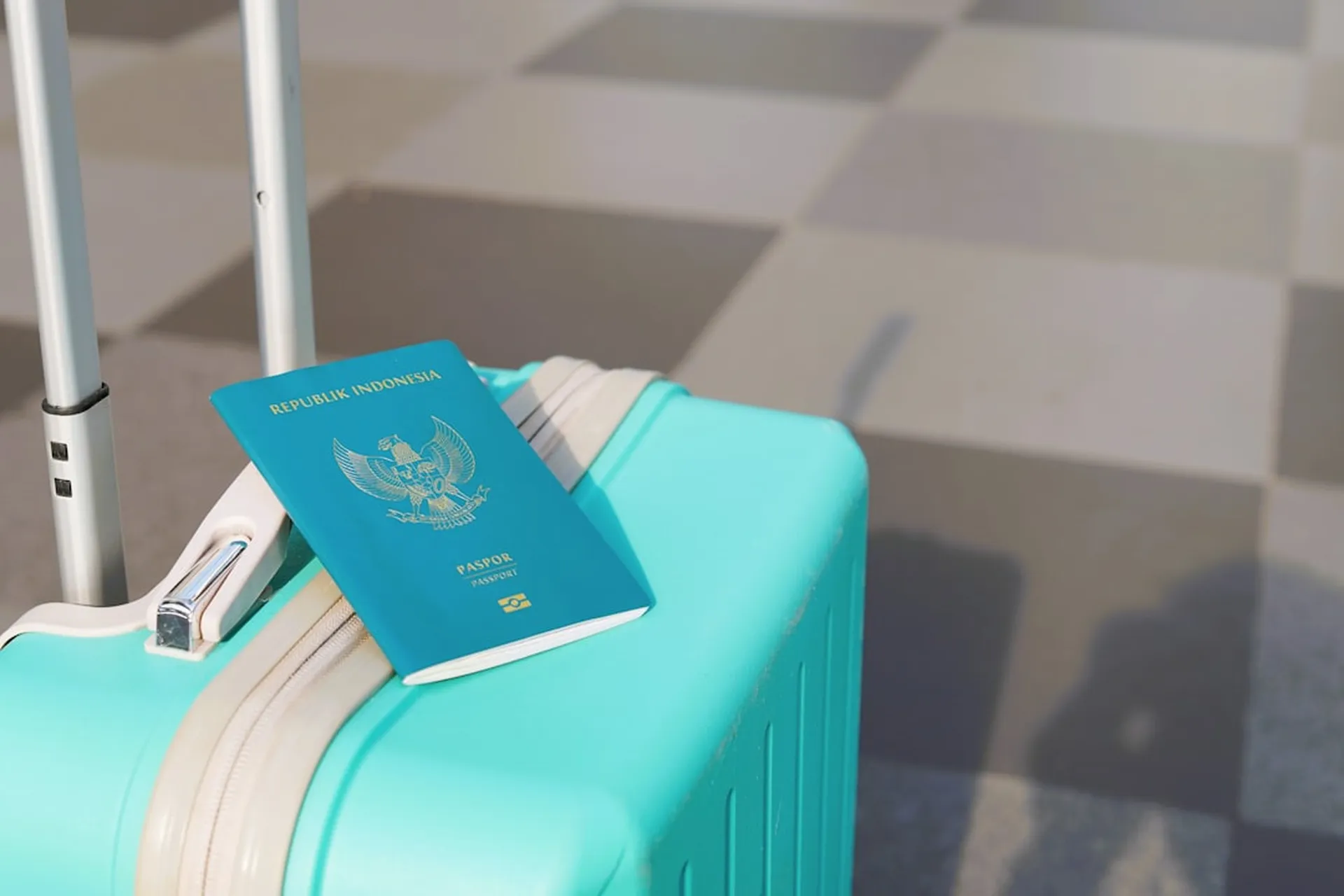 A passport resting on a suitcase