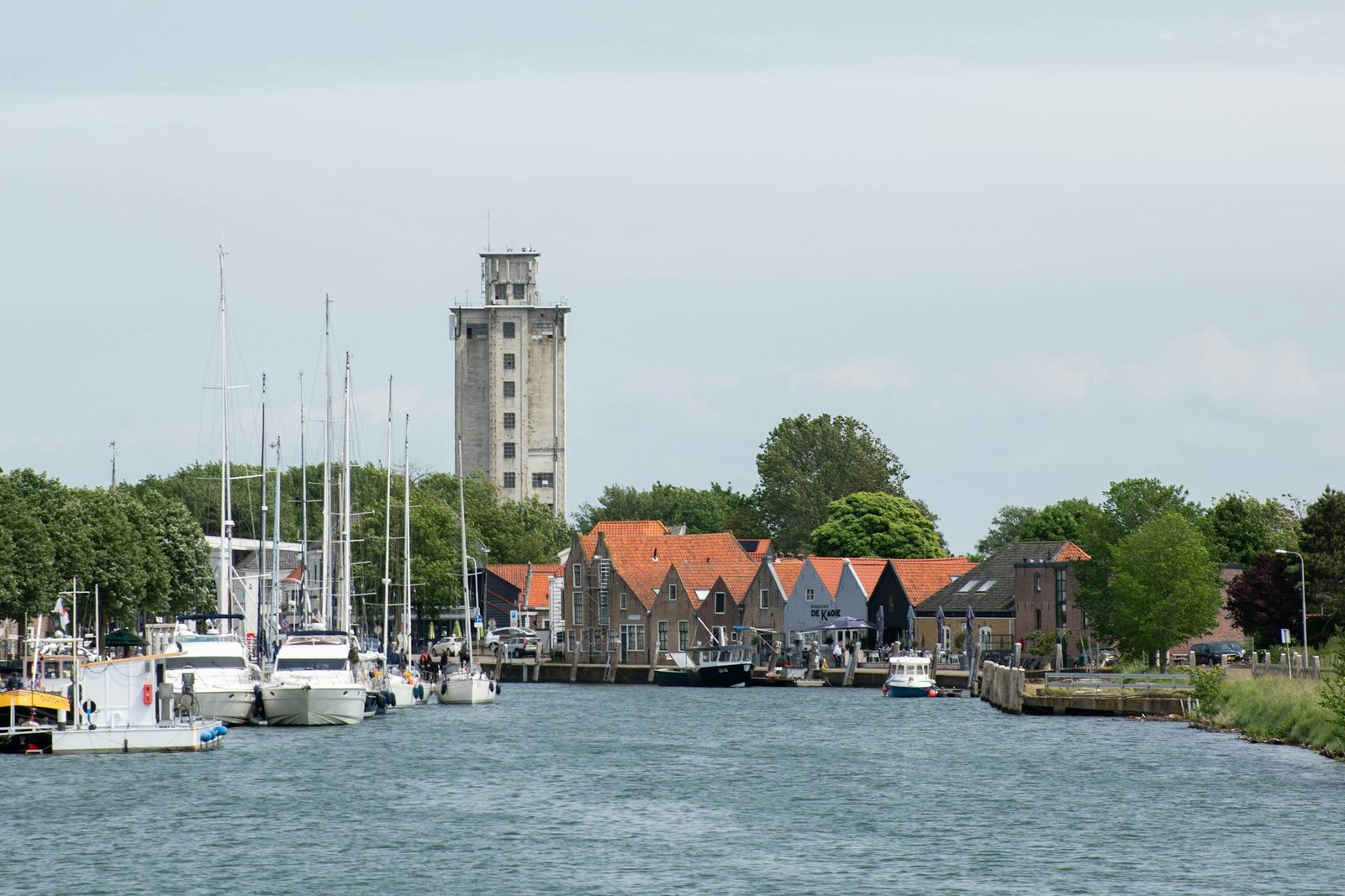 Boats moored in the harbour of a small Dutch town.