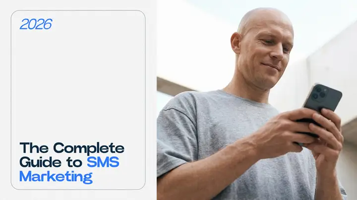 SMS marketing guide hero image with man looking at his mobile phone