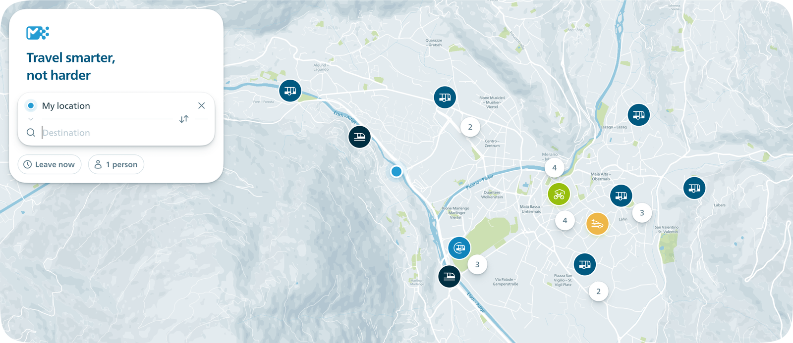 Die App zeigt eine Karte des Raums Meran mit Haltestellen für Bus, Bahn, Seilbahn und Leihrad sowie ein Feld für die Reiseplanung