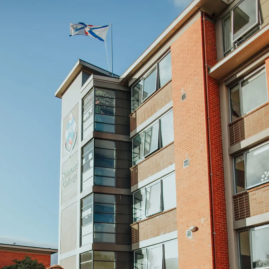 Salmond College building exterior with flag flying