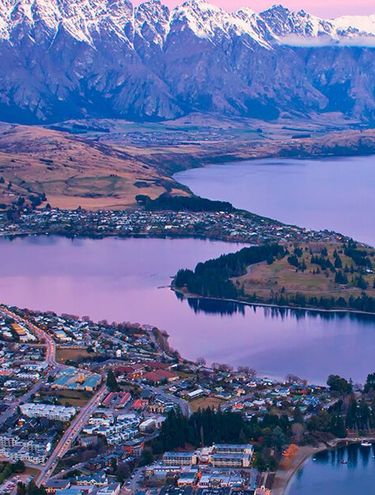 Image taken from the top of the Skyline Gondola looking down over Queenstown and Lake Wakatipu at dusk
