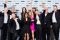 Image of the GO Rentals team standing together in formal dress