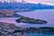 Image looking down on Queenstown and Lake Wakatipu from the top of the Skyline Gondola as dusk