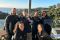 Image of the GO Rentals team standing together outdoors by the water