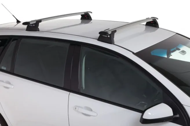 Silver crossbar roof rack fitted to the roof of a white station wagon