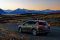 Image of a Toyota Rav4 at dusk overlooking a lake and mountains of the South Island