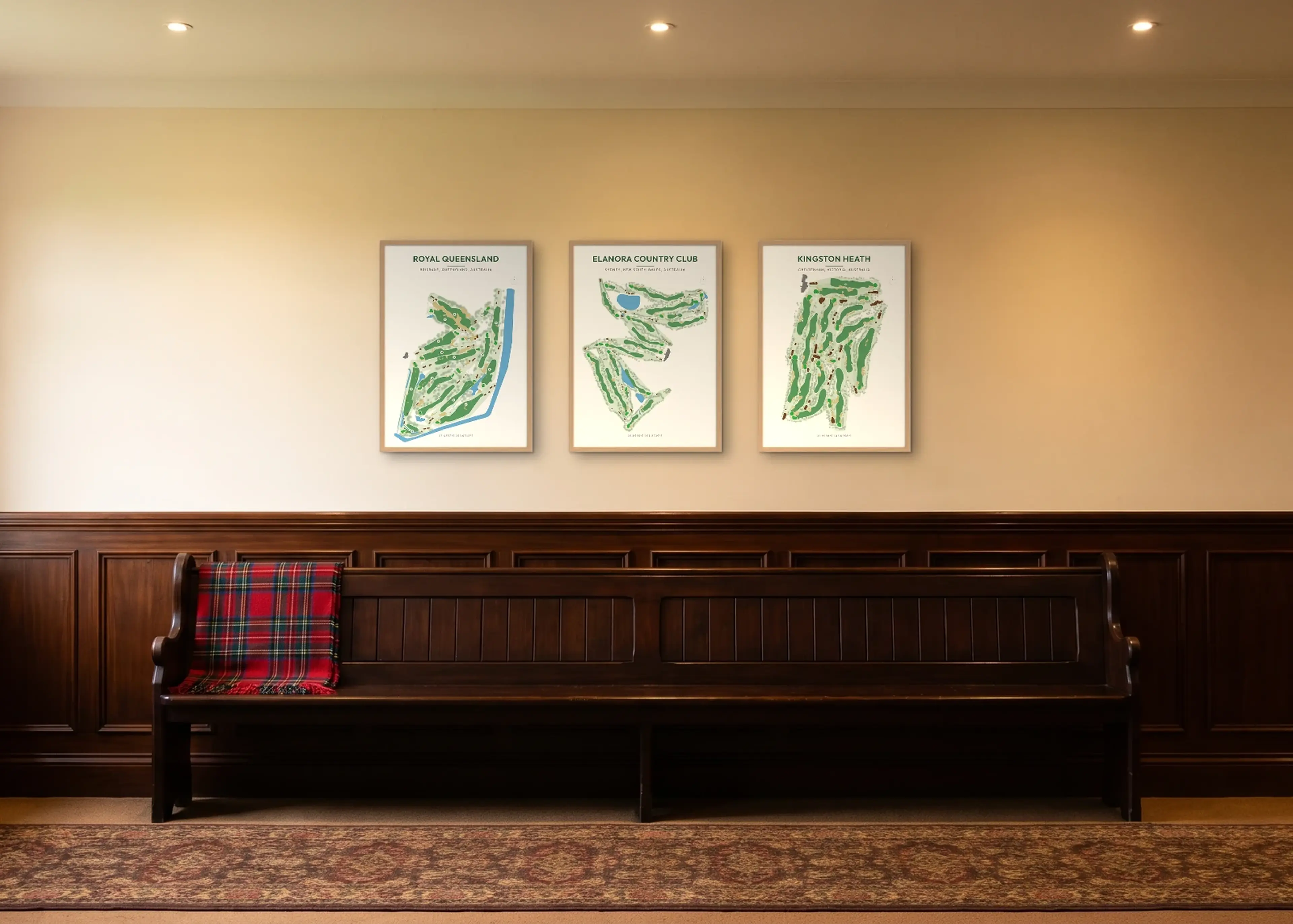 Three course prints in matching Natural frames along a clubhouse corridor