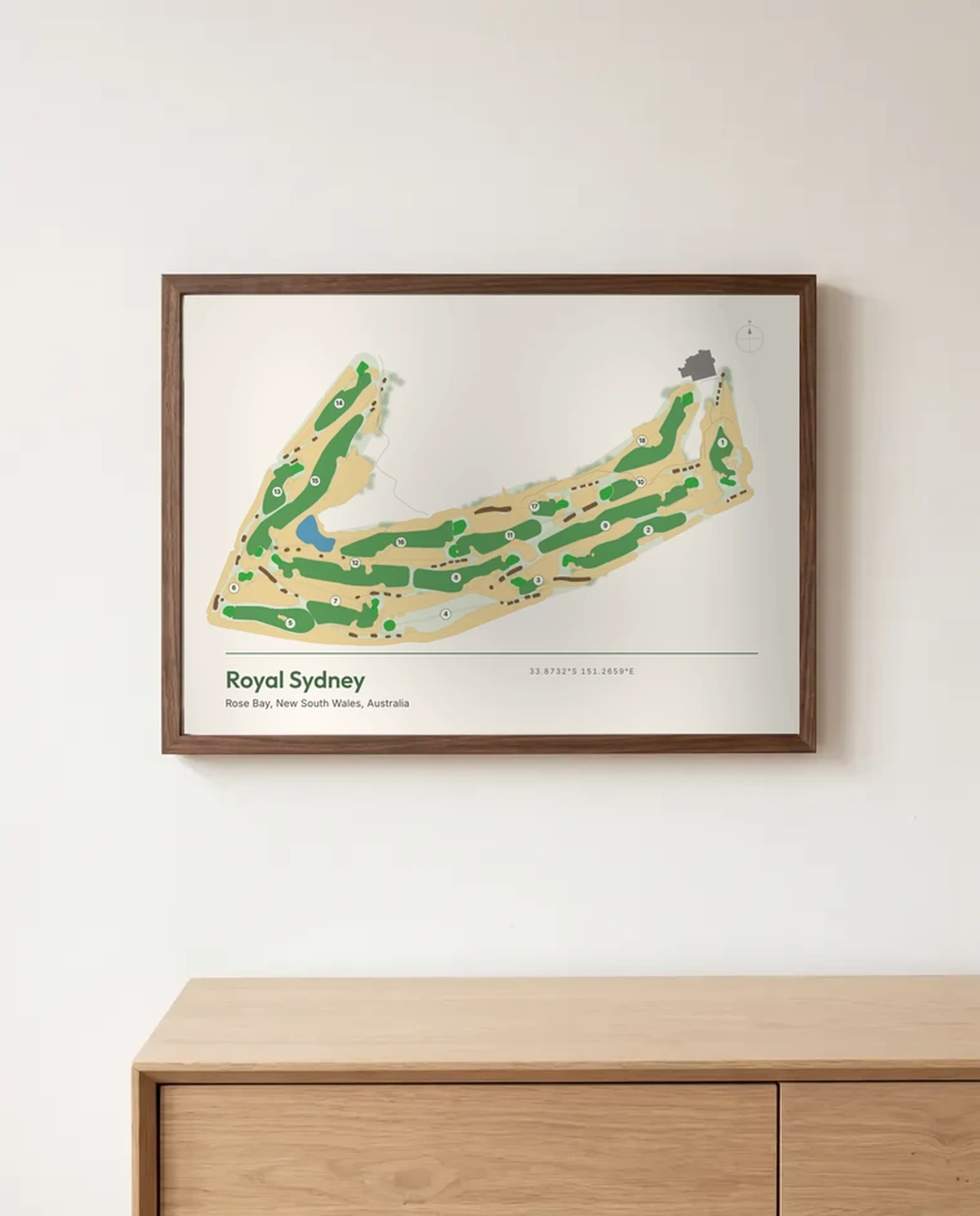 A Royal Sydney print in a Brown frame above a sideboard
