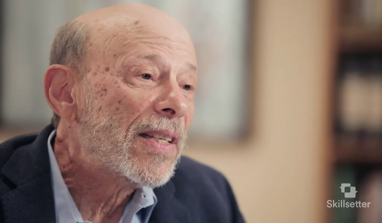 Dr. Bruce Wampold speaking to camera in an interview