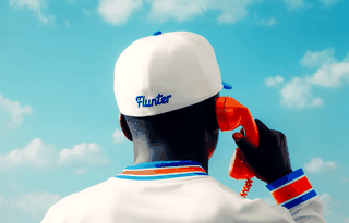 A baseball man on the phone from flunter
