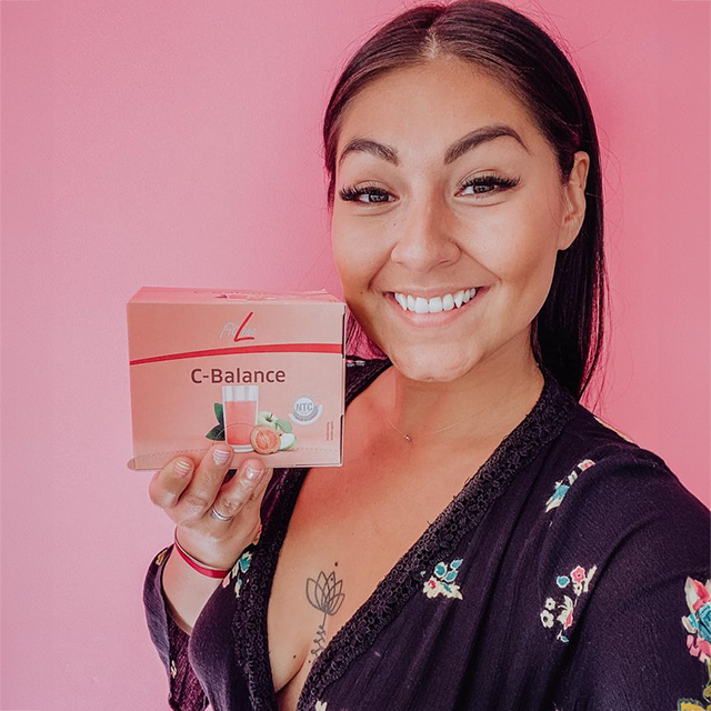 Photo of Romy Fournelle - the author of the testimonial - holding the product.