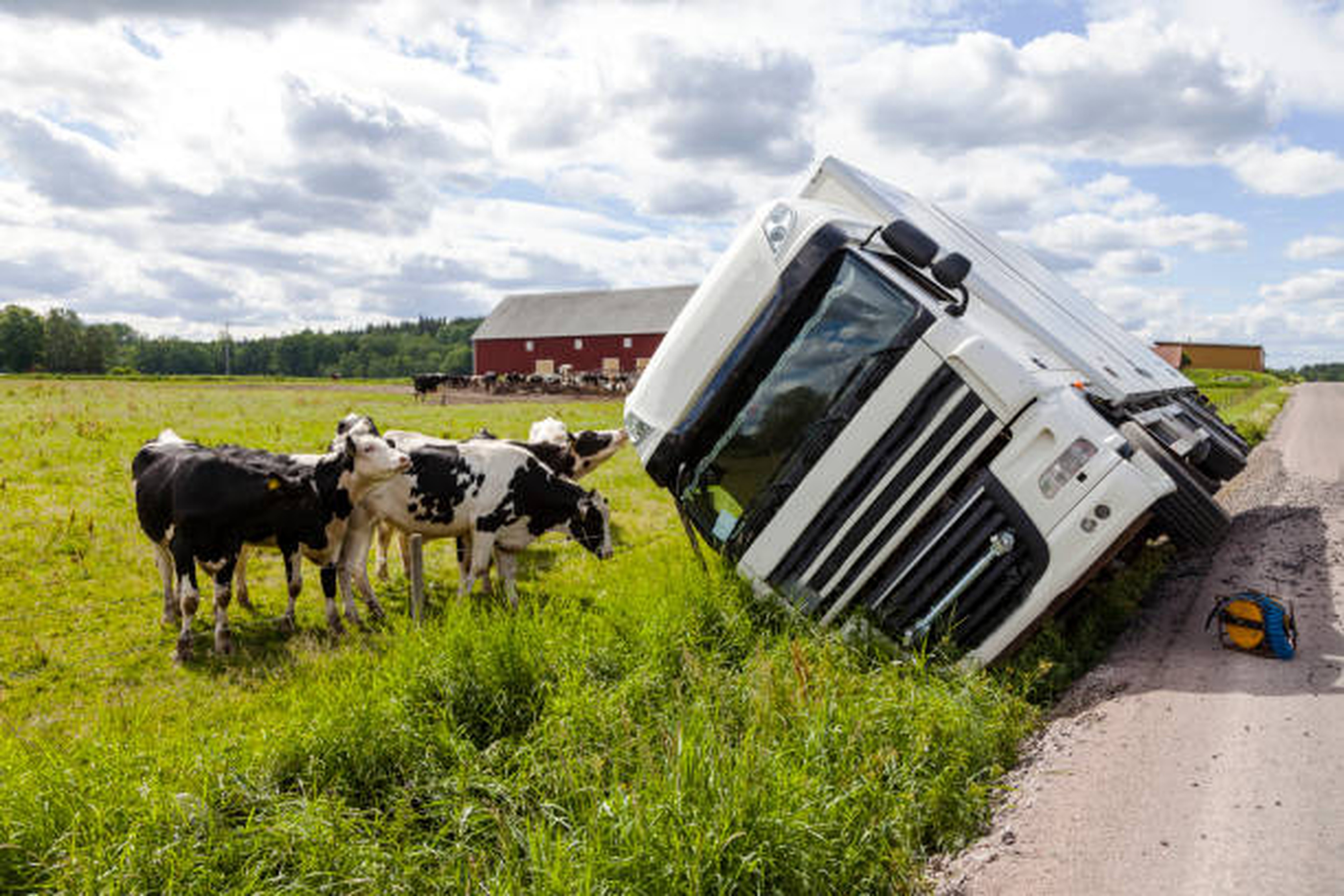 A truck is lying on the ground after an accident that will generate a dispute for the damaged good
