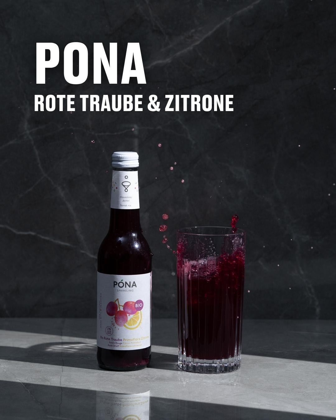 Flasche Póna Rote Traube & Zitrone neben einem gefüllten Glas