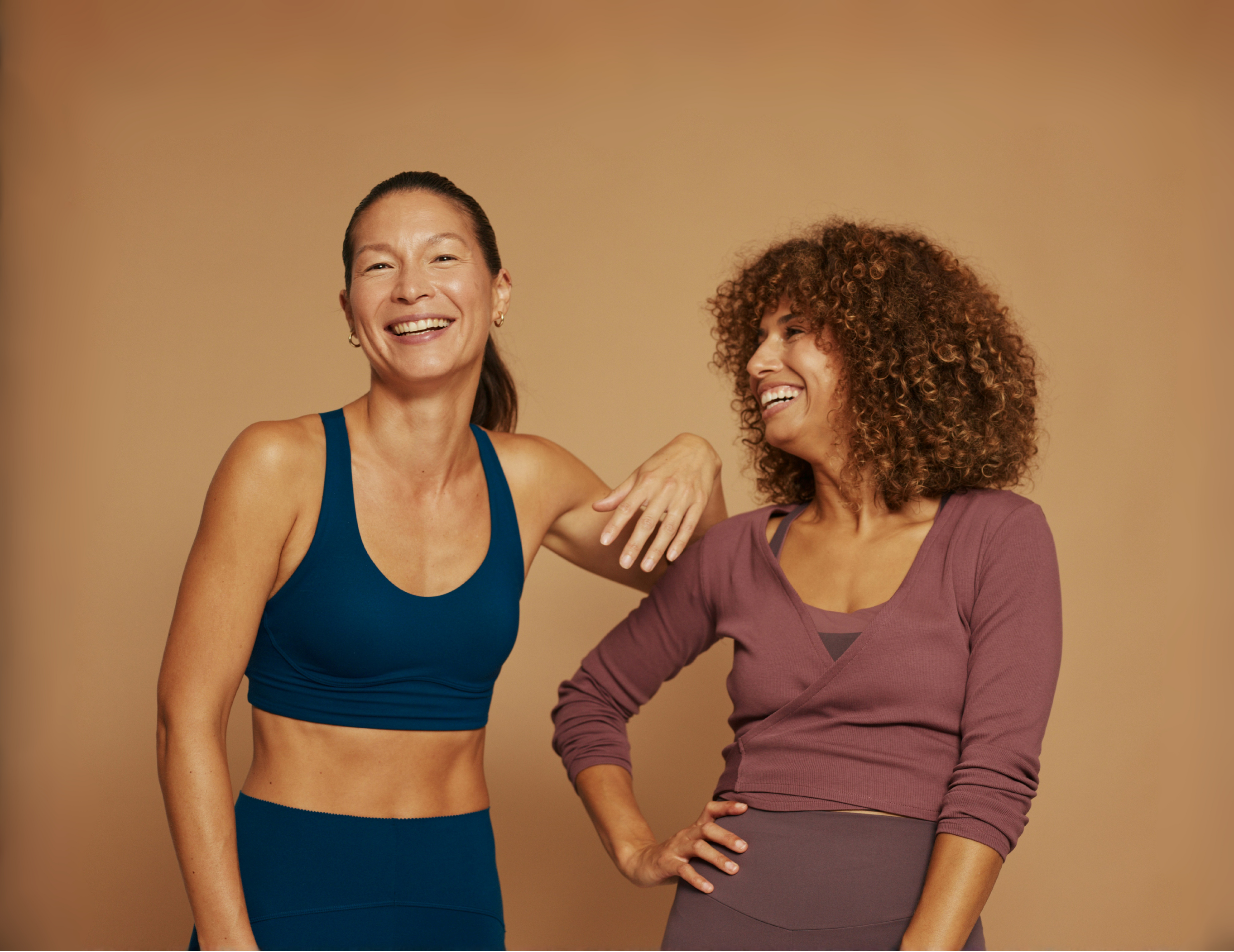 Two women laughing after a workout