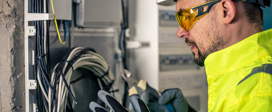 Electrician Working on Electrical Panel
