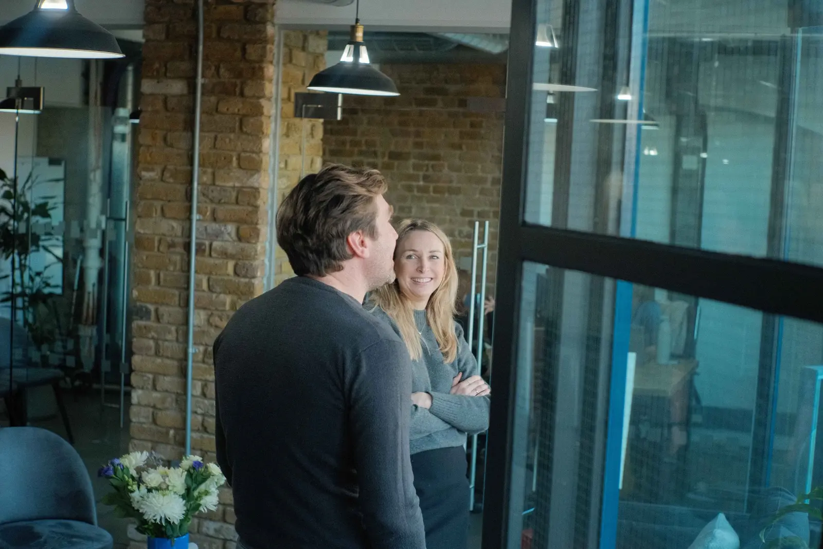 Two members of the Tom&Co team in conversation at the studio