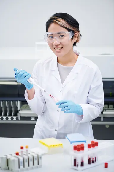 Laboratory scientist preparing samples for NGS assay development and validation.
