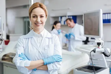 Laboratory professional with laboratory equipment.