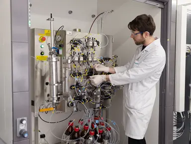 Researcher working with manufacturing technology for nucleic acid therapeutics development.