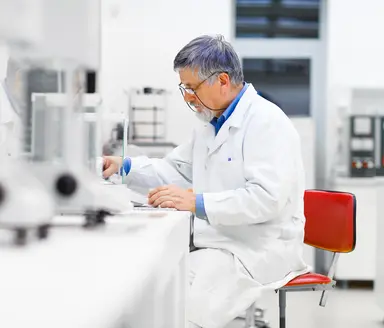 Scientist working in a laboratory environment, representing expert support for sequencing project planning, workflow development, library preparation and genomic analysis
