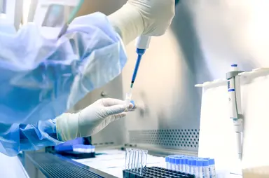 Laboratory scientist using a micropipette to prepare samples in a molecular biology laboratory, representing the growing adoption of genomics, sequencing and molecular testing across research and healthcare applications.