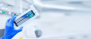NGS sequencing cartridge in a laboratory setting representing library preparation, indexing primers, adapters and multiplexed sequencing workflows.