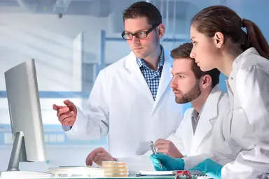 Laboratory team reviewing data