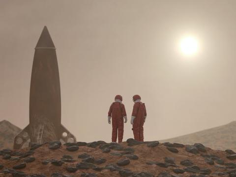 Two astronauts and their spaceship standing on a rocky, hazy planet with the sun in the sky.