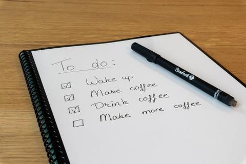 A checklist written on a notepad.
