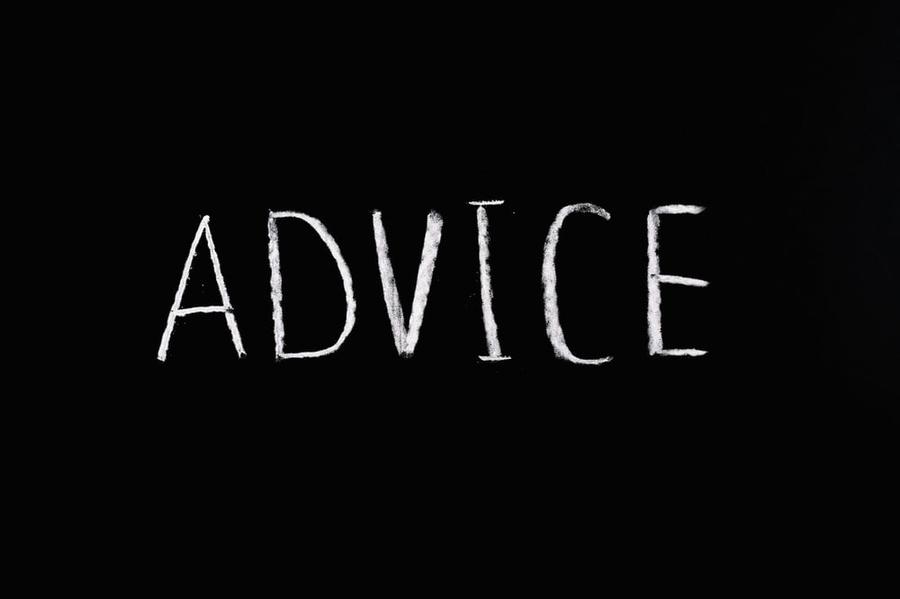 A chalkboard with the word "advice" written on it in all-caps.