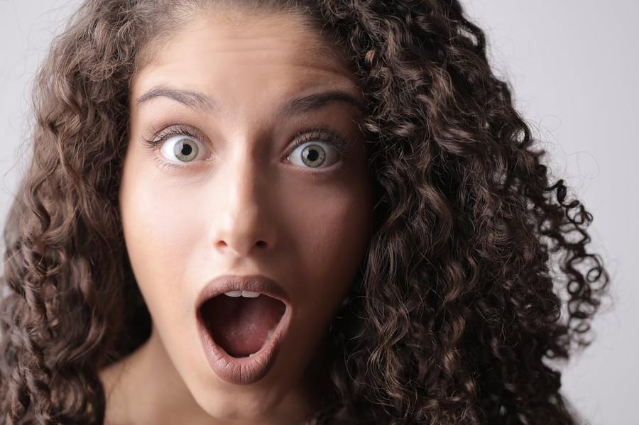 Close-up of a person with a shocked expression.