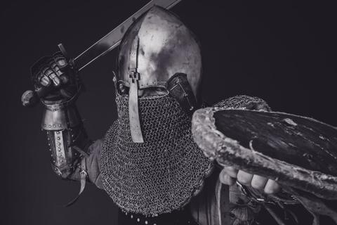A knight swinging their sword.