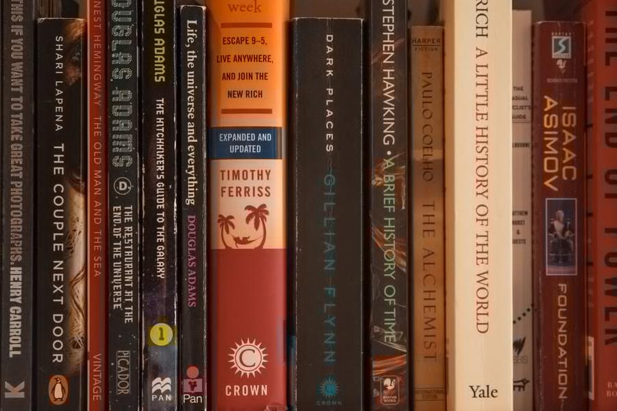 A shelf full of weathered books.